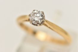 A YELLOW METAL SINGLE STONE DIAMOND RING, claw set with a round brilliant cut diamond, measuring