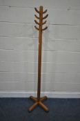IN THE FORM OF ABBESS, A MID-CENTURY COAT / HAT STAND, with eight arms, height 175cm, condition