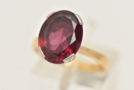 AN 18CT GOLD SINGLE STONE RING, an oval cut garnet, approximate total carat weight 5.50ct,