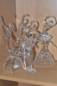 A GROUP OF FOUR CRYSTAL CUT SCULPTURES comprising three Royal Crystal Rock 'Dancing Figures'