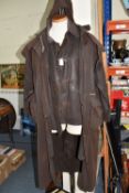 A DRIZA-BONE WAXED STOCKMAN RIDING COAT, made in Australia, dark brown, size XXS, length 113cm,