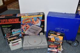 BOX OF NINTENDO SNES GAMES AND VIDEO GAME CONSOLES, includes a boxed Street Fighter II SNES