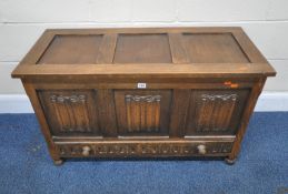 A 20TH CENTURY OAK LINENFOLD BLANKET CHEST, with a single hinged lid, and a single drawer, width