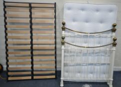 A WHITE TUBULAR METAL 4FT BEDSTEAD, with a mattress, condition report: frame with marks, scuffs,
