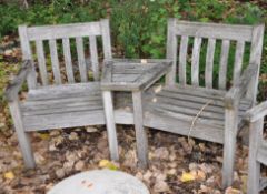 A HARDWOOD GARDEN CORNER BENCH with central angled shelf, width 165cm. Condition Report;