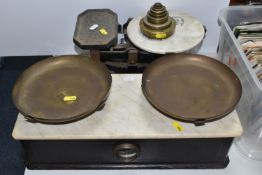 TWO LARGE SETS OF BALANCE SCALES comprising a cast iron set of scales with a ceramic 'justice'