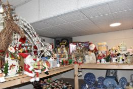 A LARGE QUANTITY OF CHRISTMAS ITEMS, to include ceramic ornaments, free standing Santa's, light up
