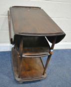 LUCIAN ERCOLANI, A MID-CENTURY ELM AND BEECH THREE TIER TROLLEY, the top tier with two drop