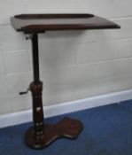 A VICTORIAN MAHOGANY READING TABLE, with a tilting surface, and a wind up mechanism, raised on a
