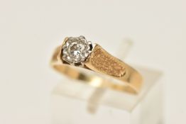 A YELLOW METAL DIAMOND SINGLE STONE RING, illusion set round brilliant cut diamond, in a white metal