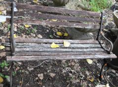 A CAST IRON AND WOODEN SLATTED GARDEN BENCH, width 122cm, Condition Report slats are decaying