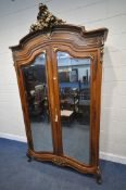 A 20TH CENTURY FRENCH ARMOIRE, with a gilt foliate crest and mounts, double bevelled mirror doors,