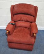 A HSL RED FABRIC UPHOLSTERED ELECTRIC RISE AND RECLINE ARMCHAIR, width 80cm x depth 89cm x height