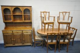A MODERN PINE DINING SUITE, comprising an extending table, with a single fold out leaf, length 169cm