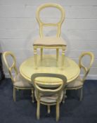 A PAINTED CIRCULAR EXTENDING DINING TABLE, raised on a single pedestal, diameter 107cm x height