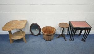A SCRATCH-BUILT TO TIER TABLE, a mirror, a coopered bucket, a wine table, and a nest of three