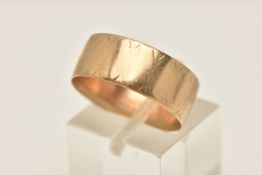 A WIDE 9CT GOLD BAND RING, approximate band width 7.7mm, worn textured pattern, hallmarked 9ct