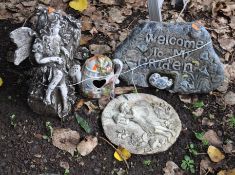 FOUR CONCRETE AND CERAMIC GARDEN ORNAMENTS, including a 'welcome' ornament with fairy sat atop a