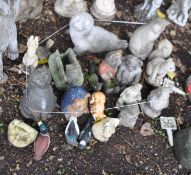 A COLLECTION OF ANIMAL GARDEN FIGURES, including cats, a seal, squirrel, hedge hogs, rabbits etc (