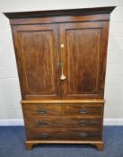A 19TH CENTURY MAHOGANY LINEN PRESS, with an overhanging cornice, the double cupboard doors