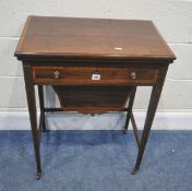AN EDWARDIAN MAHOGANY AND CROSSBANDED WORK TABLE, the rotating fold over surface enclosing a green