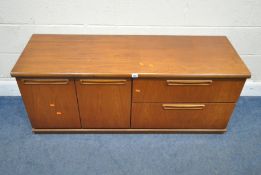 A MID-CENTURY TEAK CABINET, fitted with double cupboard doors and two drawers, width 135cm x depth