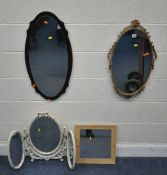 A GILT METAL OVAL WALL MIRROR, with foliate details, 40cm x height 69cm, a white triple dressing