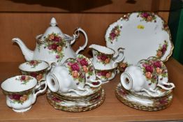 A TWENTY-ONE PIECE ROYAL ALBERT 'OLD COUNTRY ROSES' TEA SERVICE comprising a teapot, a milk jug, a