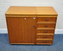 A HORN COLLECTION SEWING CABINET, with two hinged lids, the left door enclosing an arrangement of