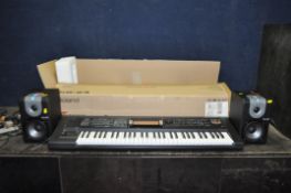 A BOXED ROLAND GW-8L WORKSTATION with power supply and a pair of Alesis M1 Active 520 powered