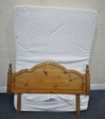 A KAYMED HARMONISE 1200 4FT6 MATTRESS, along with a pine headboard, condition report: mattress cover