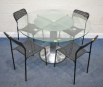 A MODERN CIRCULAR GLASS DINING TABLE, with a lazy Susan in the centre, diameter 120cm x height 76cm,