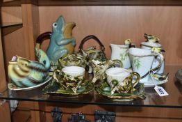 A COLLECTION OF NOVELTY TEA WARES, comprising four pieces of Graff porcelain, each modelled with a