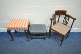 AN EDWARDIAN MAHOGANY AND CROSS BANDED CORNER CHAIR, with a central crest, scrolled armrests,