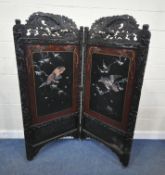 A 20TH CENTURY JAPANESE BYOBU DOUBLE PANEL FOLDING SCREEN, the carved crest and frame depicting