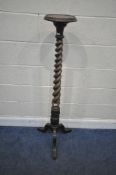 A 20TH CENTURY MAHOGANY PLANT STAND, with a spiral support, acanthus leaf details, raised on three