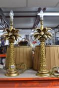 A PAIR OF TABLE LAMPS in the form of palm trees laden with date fruit, made from a composite