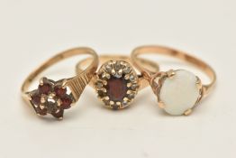 THREE GEM SET RINGS, to include a 9ct gold garnet and CZ cluster ring AF (stones missing),