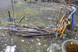 A COLLECTION OF GARDEN TOOLS including a sack truck, rakes, hoes, spades, forks, clippers, etc