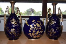 THREE CONTINENTAL GILT VASES, comprising a pair of Ernst Wahliss, Vienna twin handled ovoid vases,