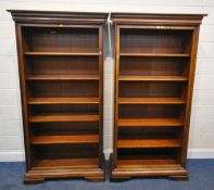 WILLIS AND GAMBIER, A PAIR OF CHERRY WOOD OPEN BOOKCASES, each with five shelves, width 104cm x
