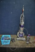 A DYSON DC 25 UPRIGHT VACUUM CLEANER, a Dyson cordless vacuum cleaner with wall bracket, charger and