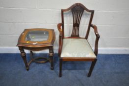 A WILLIS AND GAMBIER OCCASIONAL TABLE, with a glass insert, raised on tapered legs, united by shaped