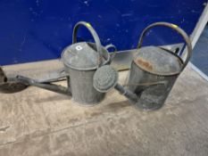 TWO EARLY 20th CENTURY GALVANISED WATERING CANS, one with a rose (2)