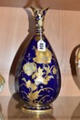 A ROYAL CROWN DERBY LOBED OVOID VASE, shape no 597, with shaped rim, tapering neck and foot,