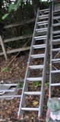 AN ALUMINIUM DOUBLE EXTENSION LADDER, with 11 rungs to each 310cm section