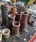 A COLLECTION OF TEN CHIMNEY POTS, including two with spiked tops. Condition Report: some have