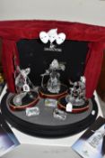A SWAROVSKI CRYSTAL 'MASQUERADE' TRILOGY WITH STAGE, comprising 'Pierrot' no 230586, designer Adi