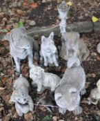 SEVEN GARDEN FIGURES IN DOG FORM, including a cast iron Scottie dog door stop, a Rottweiler 55cm