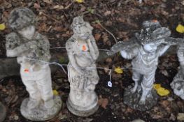 THREE CONCRETE GARDEN FIGURES, comprising of a Grecian lady and two boys, the tallest being 70cm